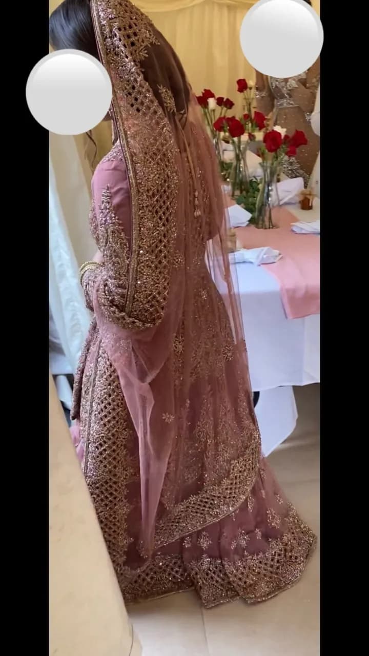 Heavy embroidered pink and gold wedding lengha